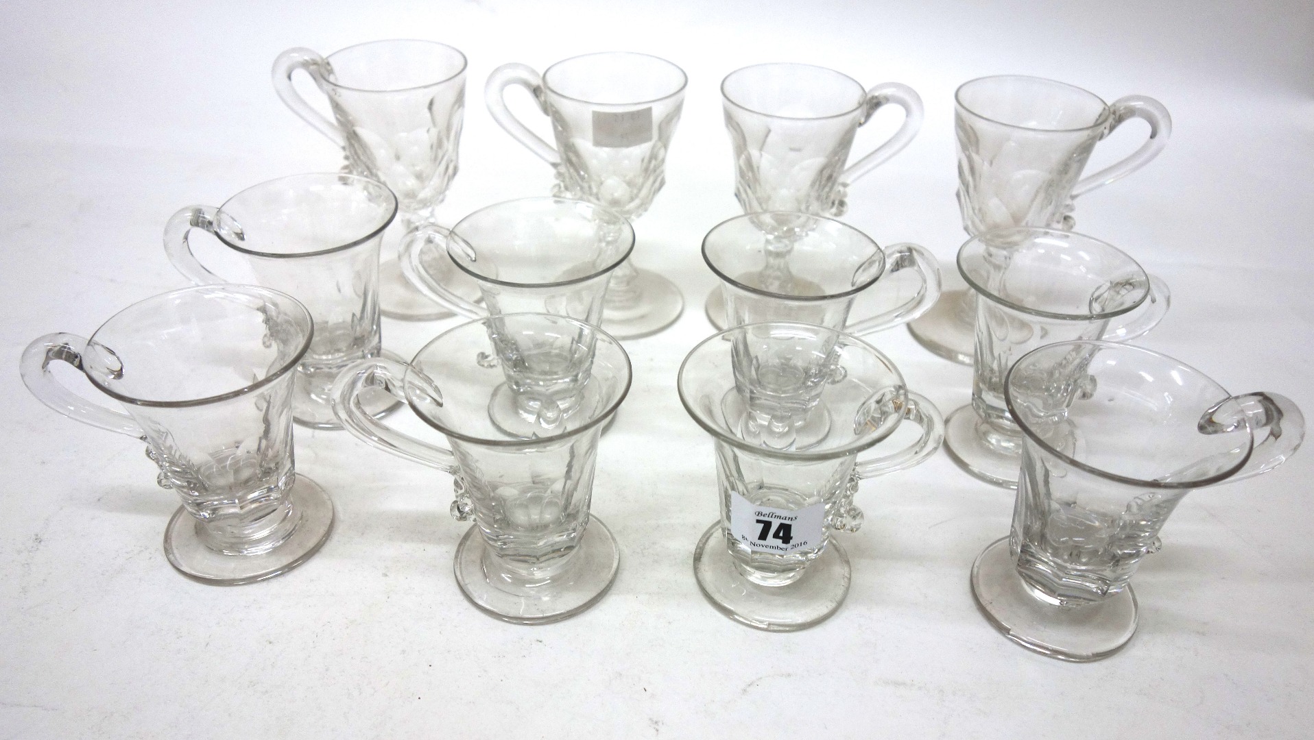 Appraisal: A set of eight George IV glass custard cups with