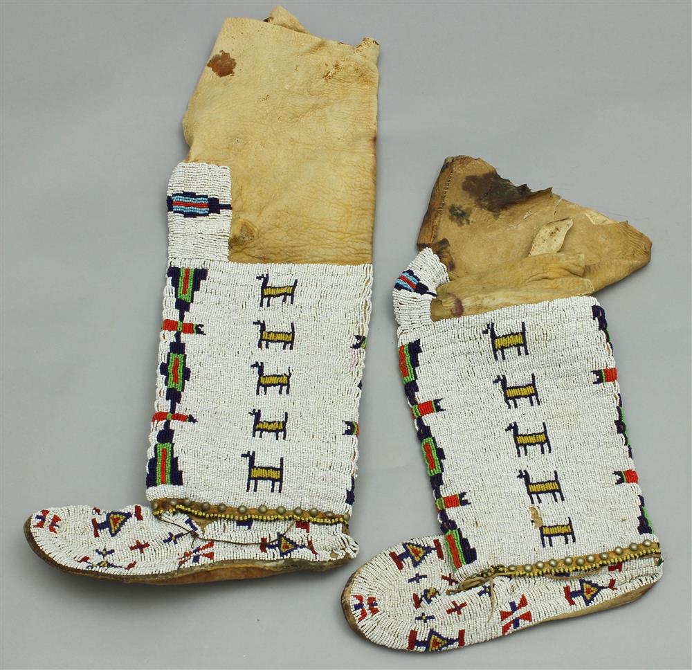 Appraisal: PAIR OF NATIVE AMERICAN BEADED HIDE HIGH-TOP WOMAN'S MOCCASINS Southern