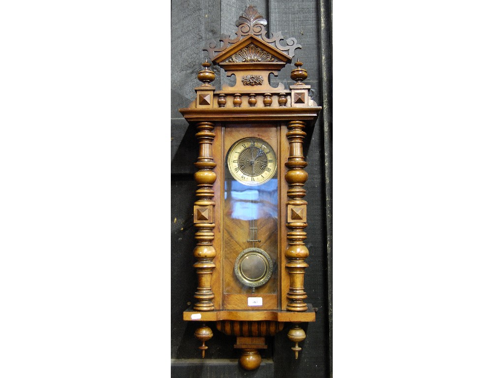 Appraisal: th century walnut Vienna wall clock the twin train movement