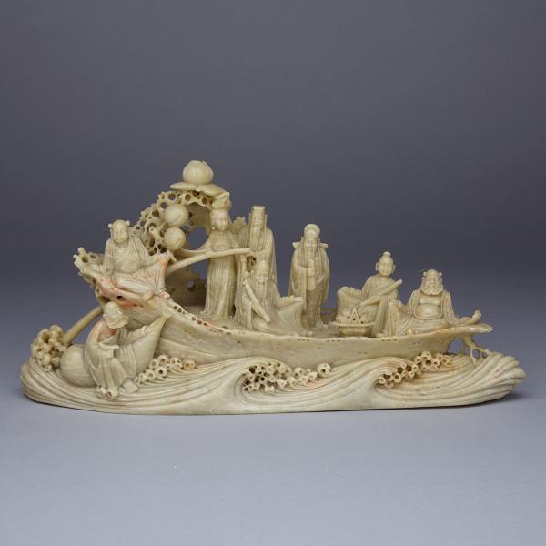 Appraisal: Soapstone Carved Eight Immortals Boat Surrounded by crashing waves the