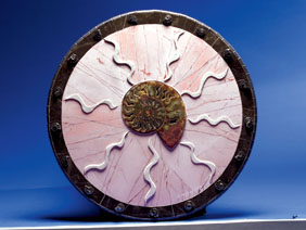 Appraisal: AMMONITE COMPOSITION CIRCLE OF SPIRALS By Susan Judy Ammonites are