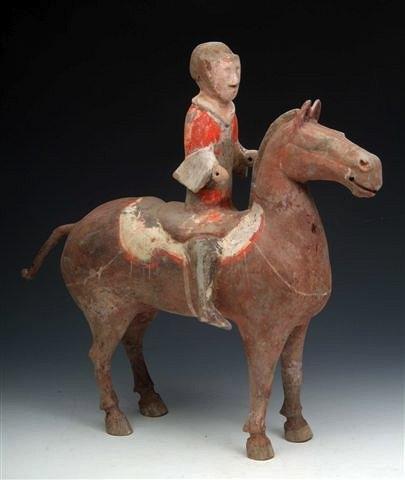 Appraisal: A HAN DYNASTY EARTHENWARE POLYCHROME HORSE with seated rider in