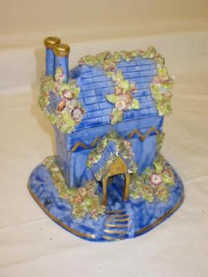 Appraisal: A VICTORIAN STAFFORDSHIRE POTTERY PASTILLE BURNER modelled as a cottage