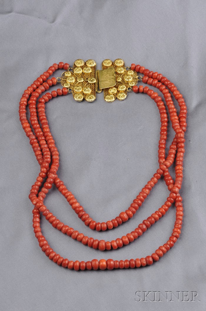 Appraisal: Coral Three-strand Bead Necklace each strand of barrel-shape coral beads