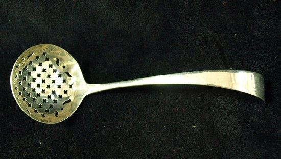 Appraisal: An Old English pattern sifter spoon crested maker's mark for