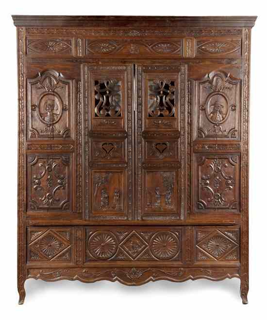 Appraisal: A Brittany Carved Oak Marriage Cabinet having a molded cornice