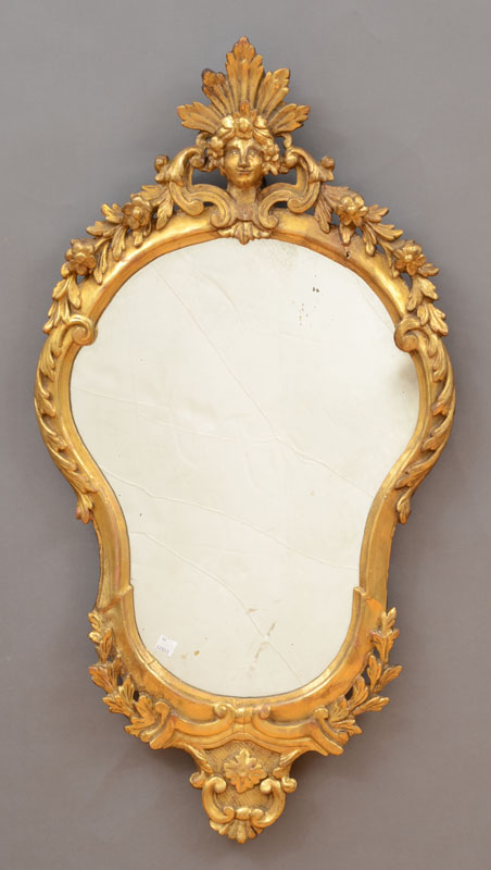 Appraisal: ITALIAN ROCOCO GILTWOOD GIRANDOLE MIRROR The cartouche-shaped mirror plate surmounted