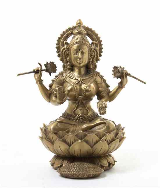 Appraisal: A South Asian Bronze Figure of Lakshmi depicted with four