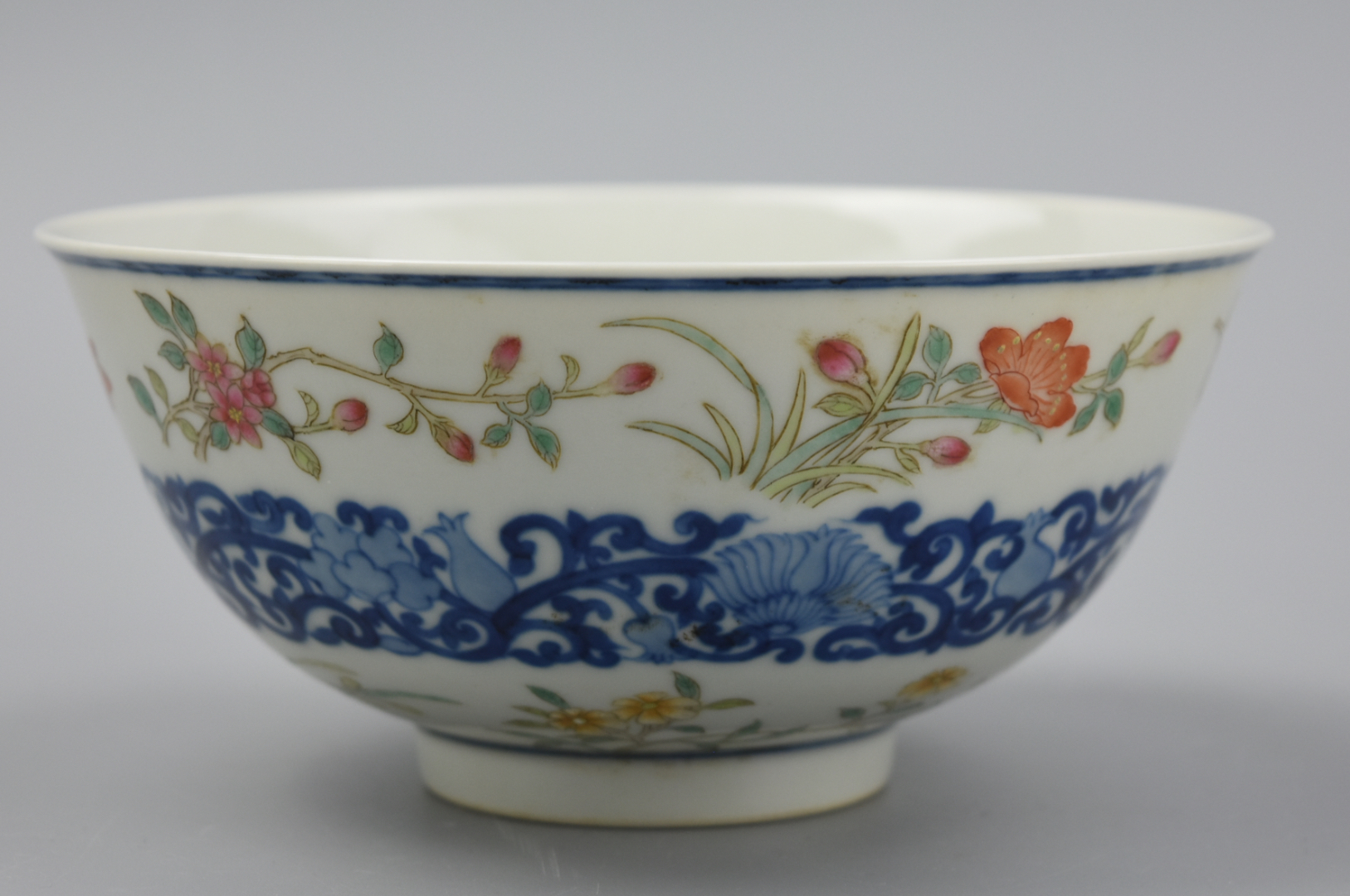 Appraisal: CHINESE FAMILLE ROSE AND BLUE BOWL TH C rounded side