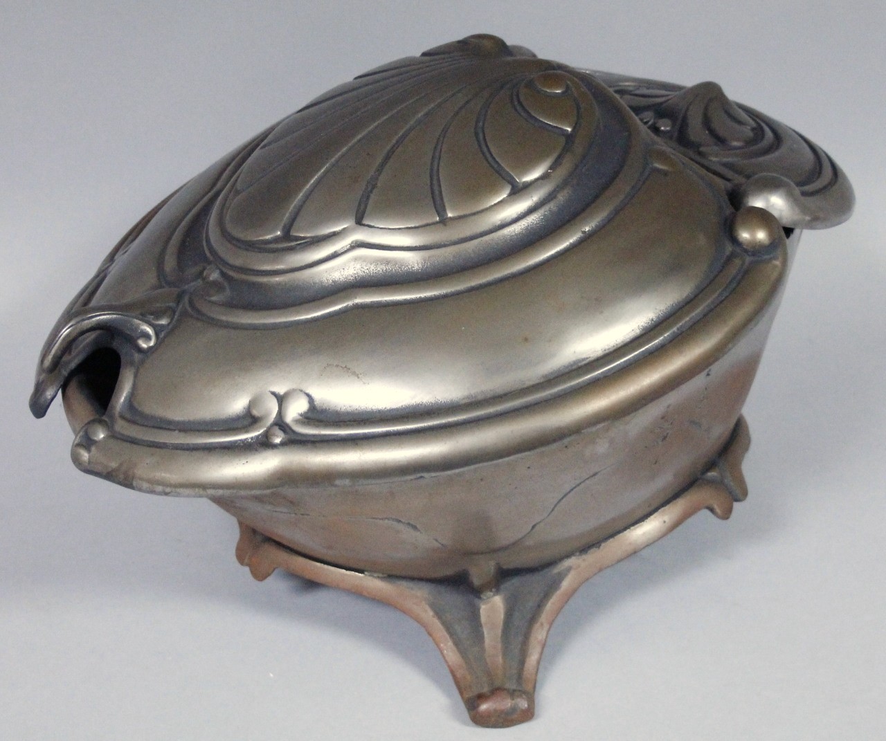 Appraisal: An Art Nouveau design metal coal box the articulated hinged