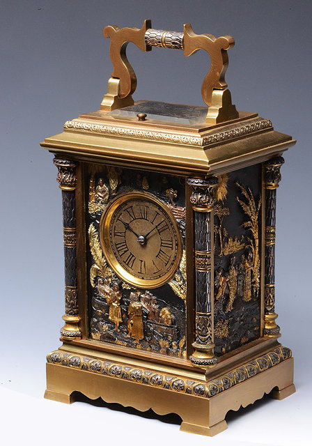 Appraisal: AN UNUSUAL CARRIAGE CLOCK having a circular gilt Roman dial