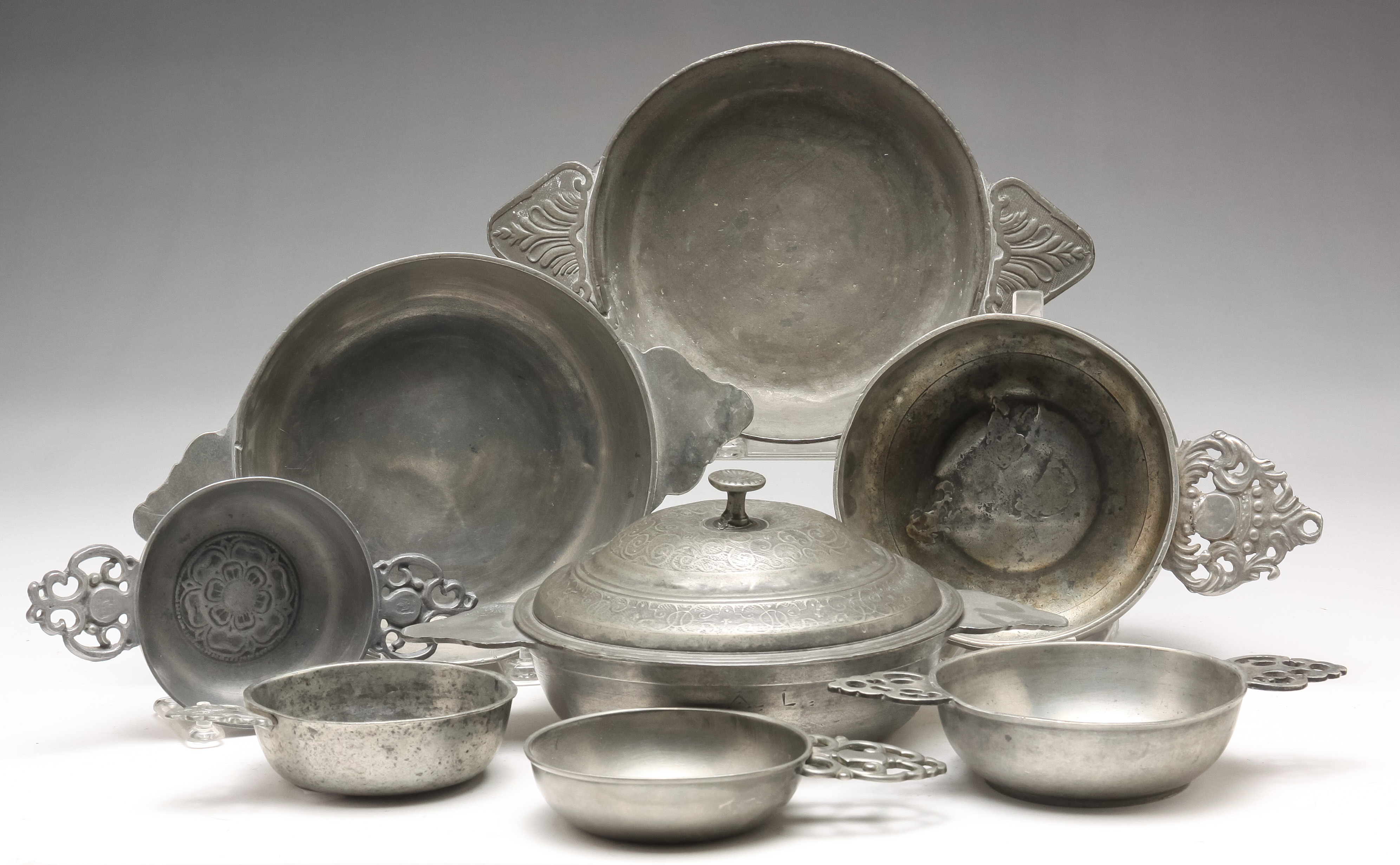 Appraisal: EIGHT AMERICAN AND EUROPEAN PEWTER PORRINGERS Nineteenth- th century Four