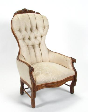 Appraisal: Victorian carved walnut demi arm chair button tufted and channel