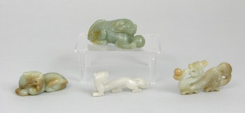 Appraisal: A Group of Carved Jade Figurines Containing a mutton white