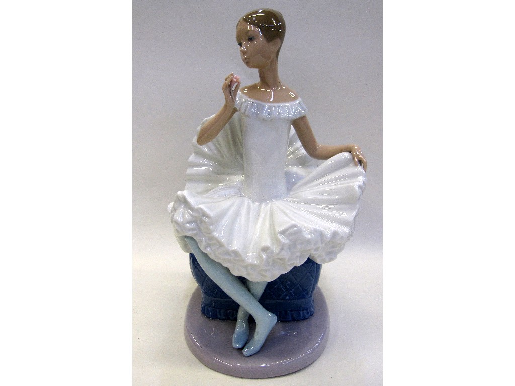 Appraisal: Nao figure of a ballerina sat upon a chair