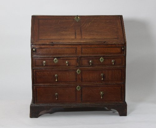 Appraisal: An oak bureau circa with step and well interior above