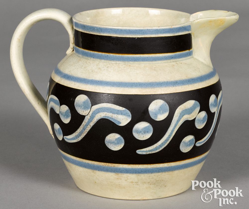 Appraisal: Mocha pitcher with cats-eye decoration Mocha pitcher with cats-eye decoration