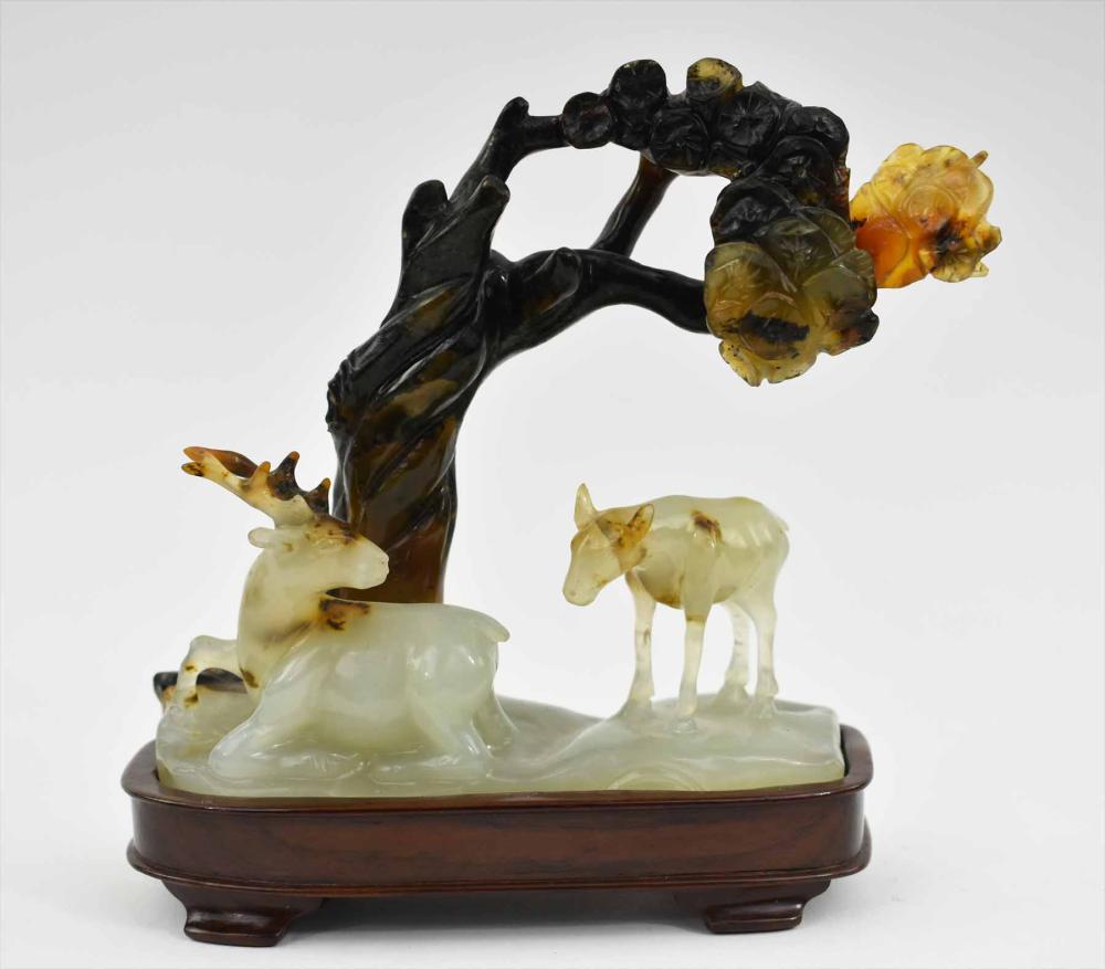 Appraisal: CHINESE TWO-TONE JADE GROUP OF TWO DEERThe male and female