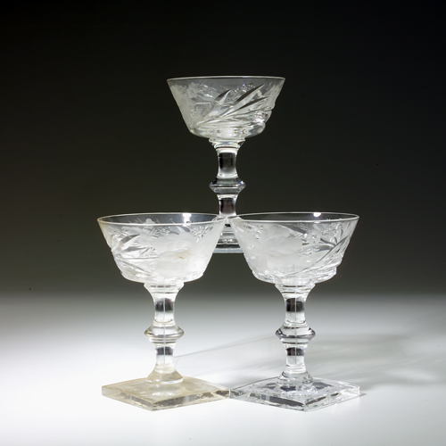 Appraisal: Twelve Hawks champagne glasses with iris design and square base