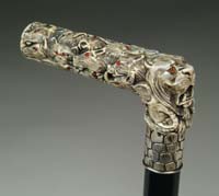 Appraisal: OUTSTANDING CARVED IVORY MULTIPLE ANIMAL HEAD CANE L-shaped handle has