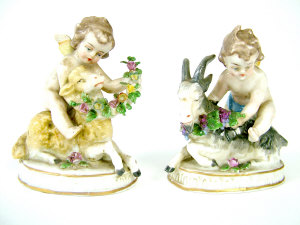 Appraisal: Pair of Samson figures of putti seated astride goats using