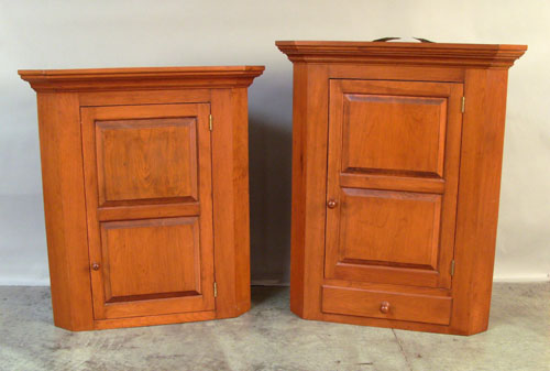 Appraisal: Two custom made cherry hanging corner cupboards h w and