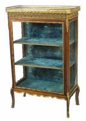 Appraisal: A French mahogany and gilt brass mounted vitrine with a