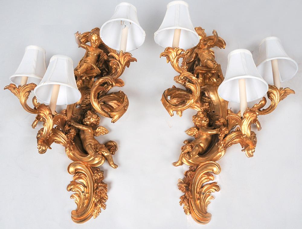 Appraisal: PAIR OF FRENCH GILT BRONZE FIGURAL SCONCESin the Louis XV