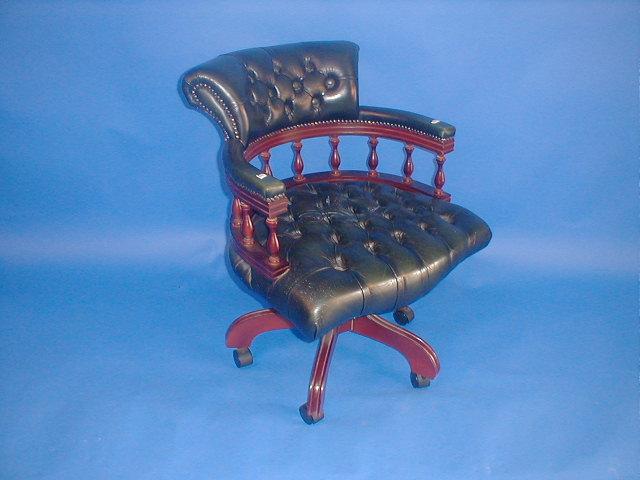 Appraisal: A reproduction leather finished swivel office chair