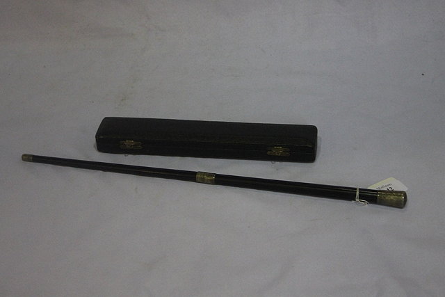 Appraisal: A CONDUCTOR'S BATON in two parts in a lined leather