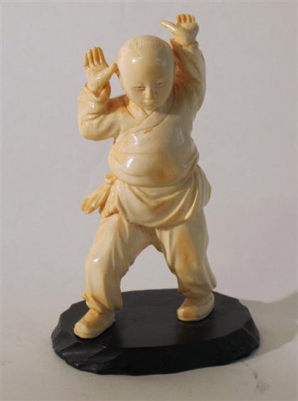 Appraisal: Chinese carved elephant ivory boyStanding figure with hands raised wood