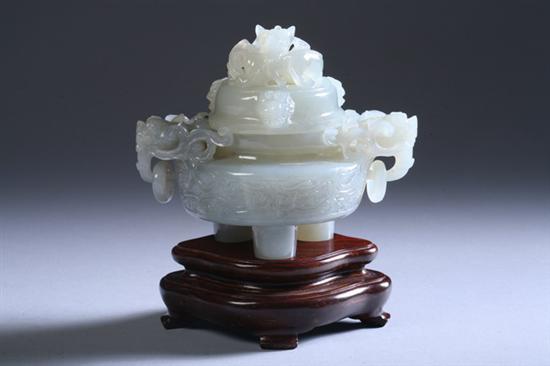 Appraisal: CHINESE CELADON JADE TRIPOD DRAGON CENSER th century Carved with