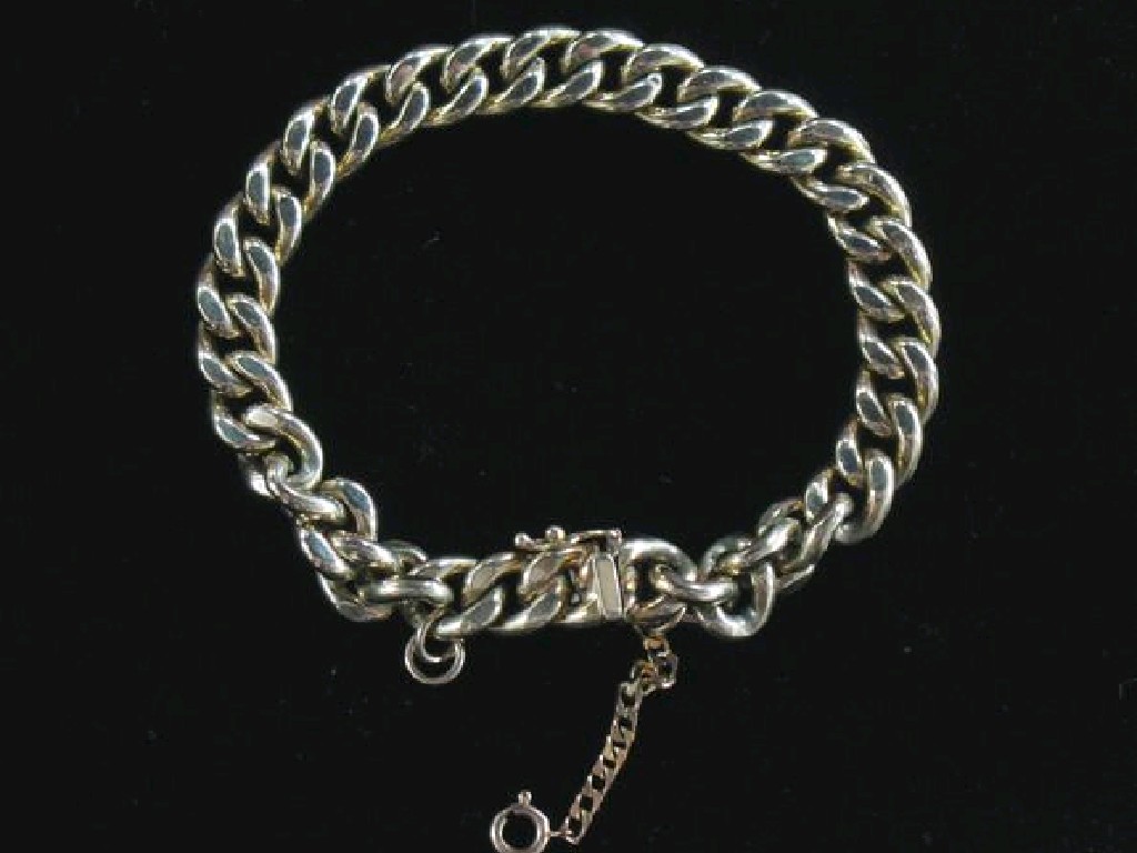 Appraisal: A CT YELLOW GOLD HOLLOW CURB LINK BRACELET with concealed