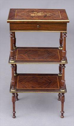 Appraisal: NAPOLEON III GILT-METAL-MOUNTED MARQUETRY-INCISED KINGWOOD THREE-TIER WORK TABLE The hinged