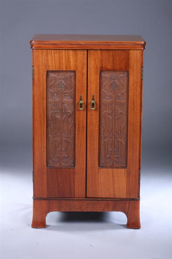 Appraisal: ART NOUVEAU MAHOGANY CARVED-PANEL MUSIC CABINET Late th century Molded-edge