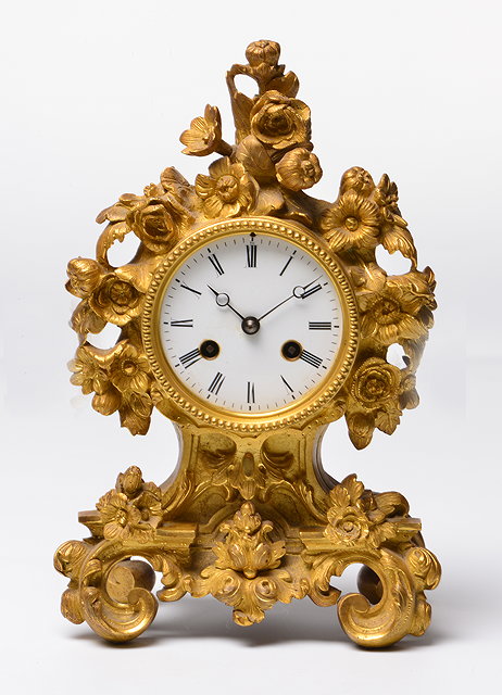 Appraisal: A TH CENTURY MANTEL CLOCK the shaped ormolu case with