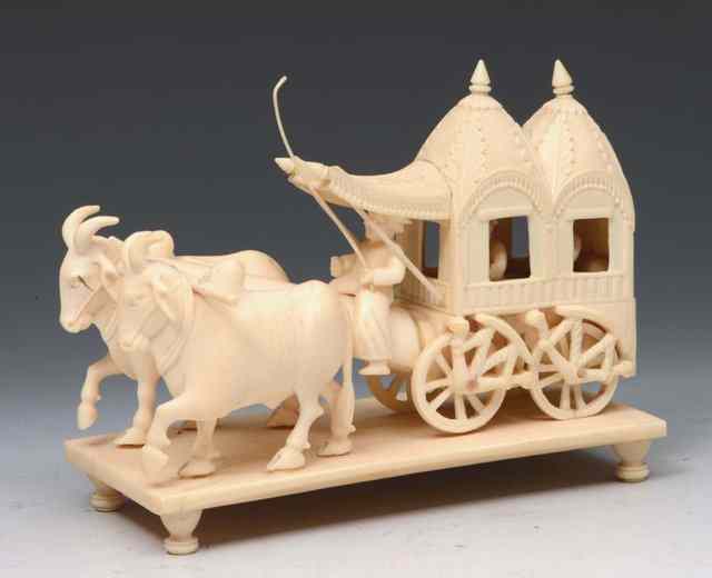 Appraisal: AN INDIAN CARVED IVORY CART drawn by two bullocks on