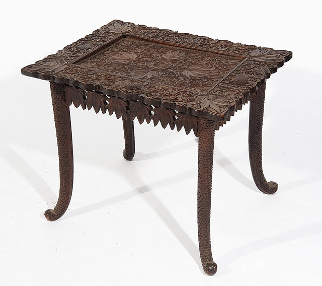 Appraisal: A BURMESE CARVED RECTANGULAR OCCASIONAL TABLE with allover leaf and