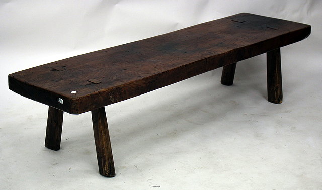 Appraisal: AN OLD RUSTIC ELM PIG BENCH with rectangular top and