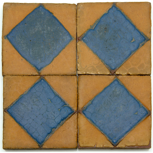 Appraisal: GRUEBY Fifty-eight geometric tiles with raised square or diamond pattern