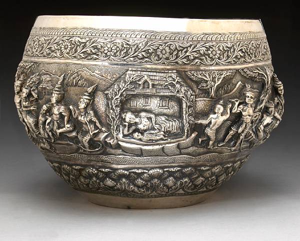 Appraisal: A Burmese silver bowl Of punch bowl form its tall