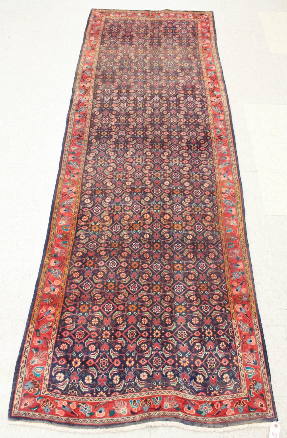 Appraisal: HAND KNOTTED PERSIAN RUG overall Herati floral design on dark