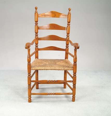 Appraisal: TH CENTURY LADDERBACK ARM CHAIR Four graduated ladderbacks supported by