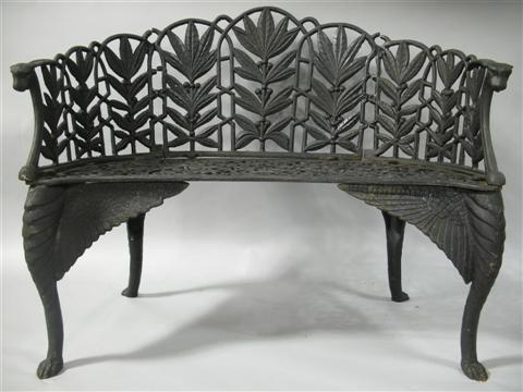 Appraisal: BLACK PAINTED WROUGHT IRON GARDEN BENCH th century the scalloped-edged