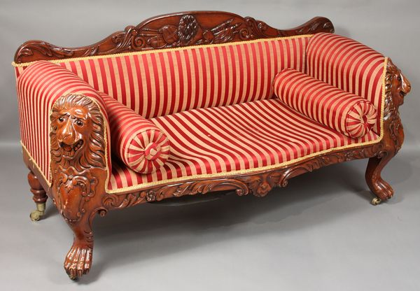 Appraisal: th Century English mahogany sofa with carved lions heads and