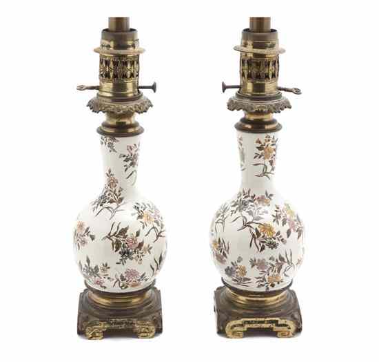 Appraisal: A Pair of French Ceramic Lamps having allover floral decoration