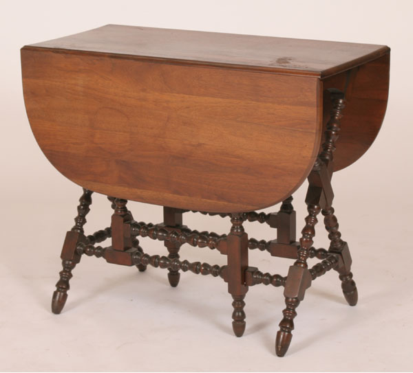 Appraisal: Mahogany butterfly drop leaf table turned sawbuck base and stretcher