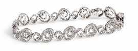 Appraisal: A ct white gold bracelet comprised of diamond set oval