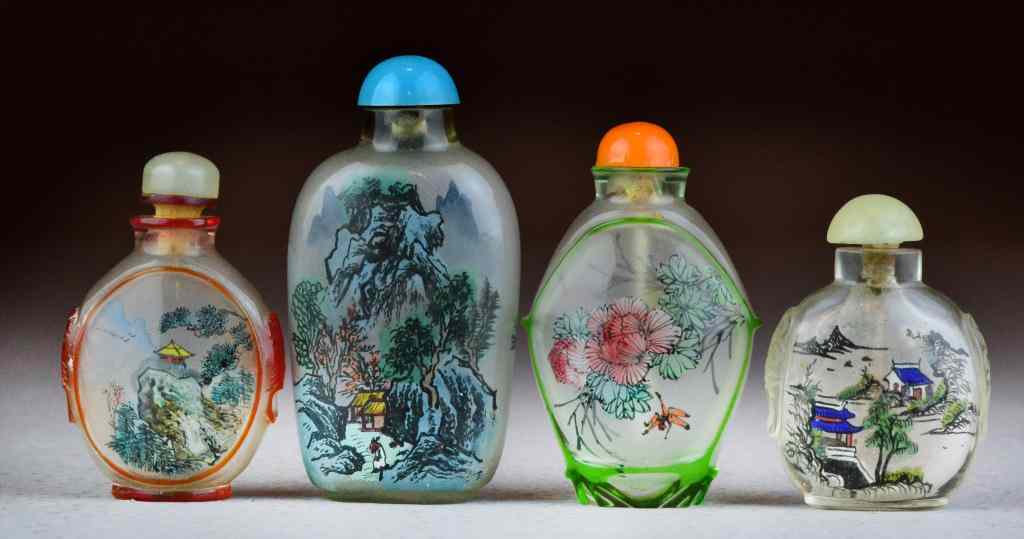 Appraisal: Chinese Inside Painted Glass Snuff BottlesPainted to depict lotus figures