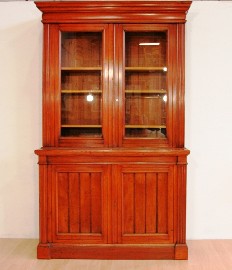 Appraisal: A late th century Australian cedar deux-corps bookcase the outstepped